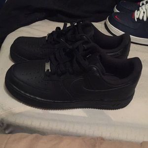A pair of all Black AirForce One’s